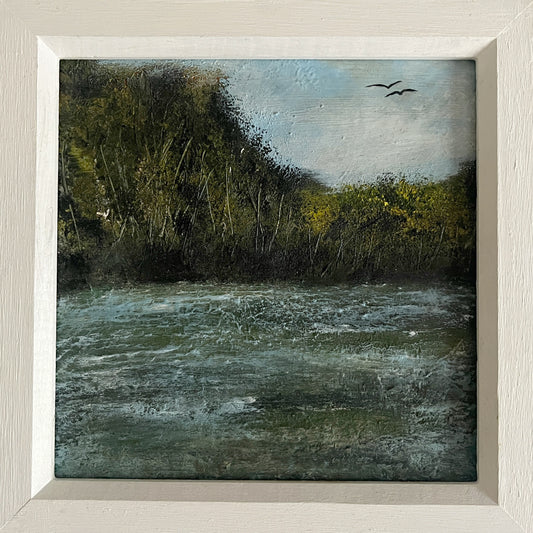 Framed painting of a natural landscape with water, trees, and birds. framed oil painting of river and trees and birds in a white wooden frame
