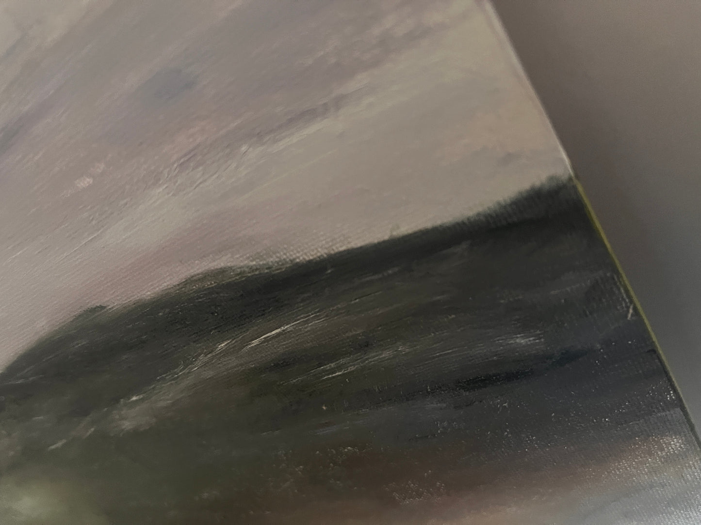 Close-up of a textured black surface with a metallic sheen