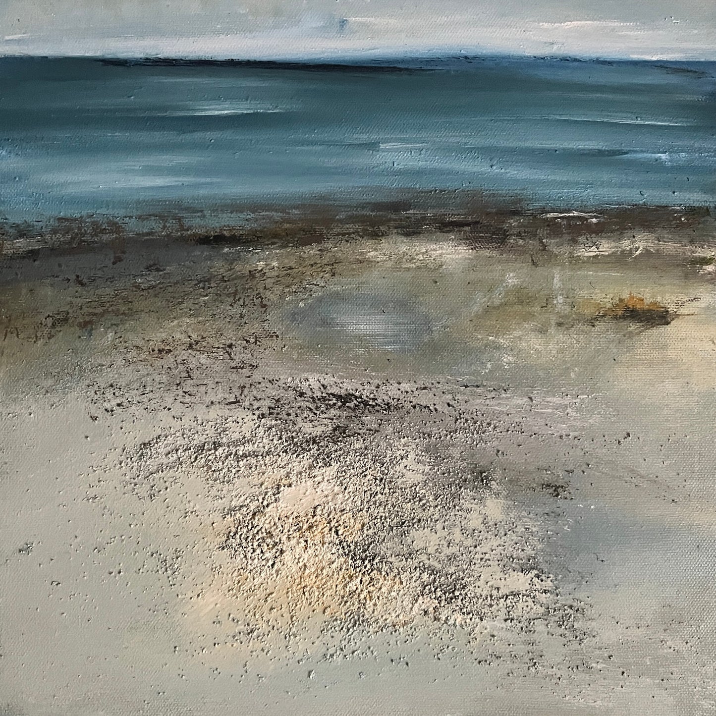 An abstract painting of a beach and sea, featuring textured blue-gray water under a pale sky with a sandy shore in the foreground.