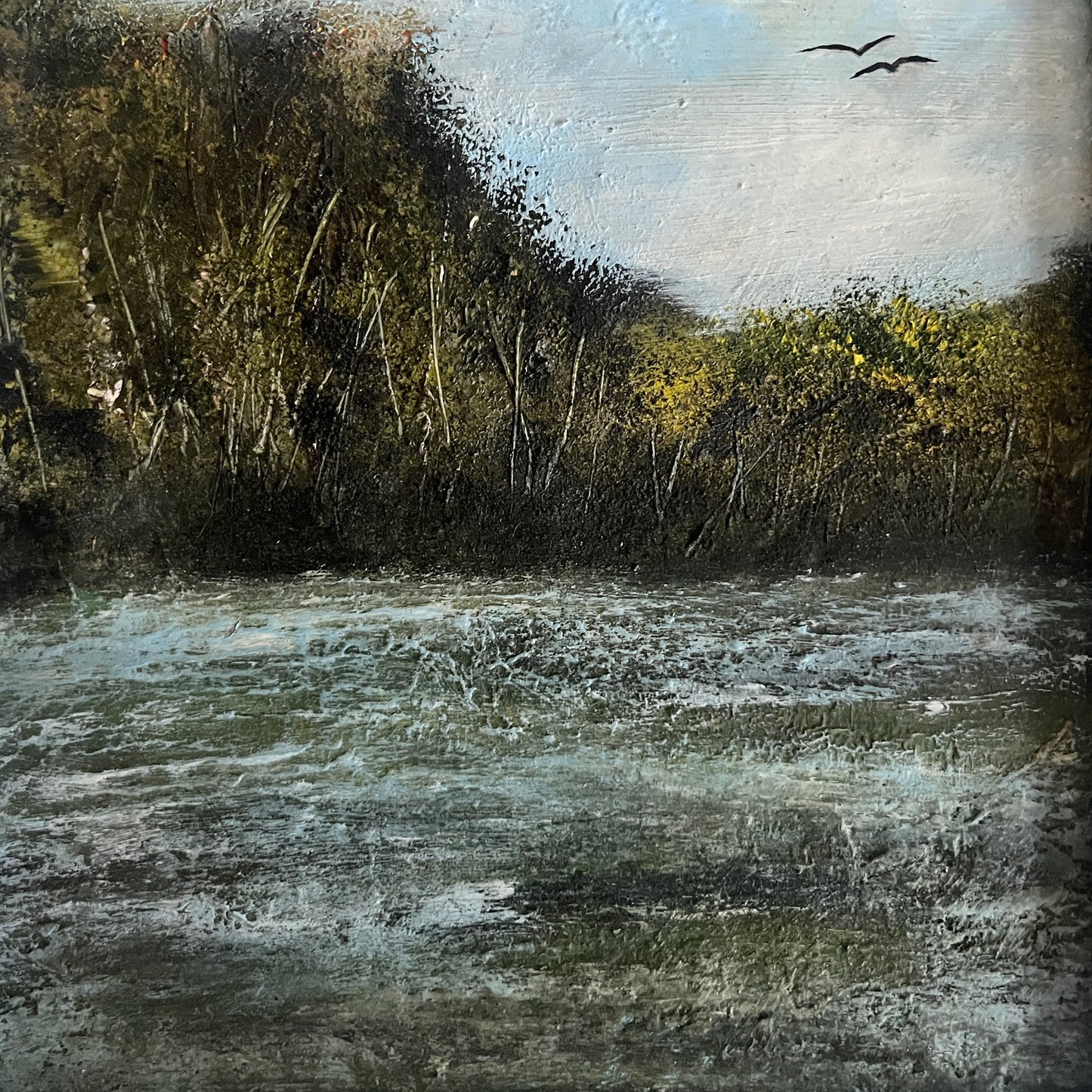 Painting of a landscape with water, trees, and birds. framed oil painting of river and trees and birds in a white wooden frame